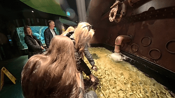 Christianne and Livia with "doctor fish" at the St. Louis Aquarium.  Image by Dan Sattel