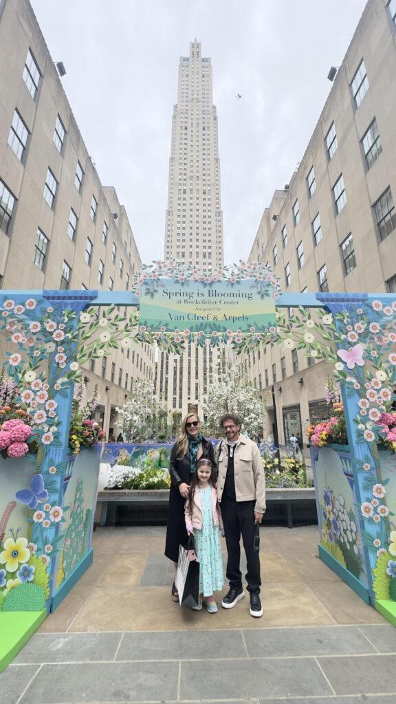"Spring is Blossoming" in Rockefeller Center in New York City.  Christianne, Dan, and Livia.  Image by Rockefeller Center.