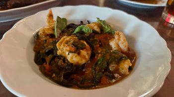 Spicy scampi linguine, made with squid ink pasta, shrimp, peppers, and ’nduja sausage. Image by Christianne Klein.